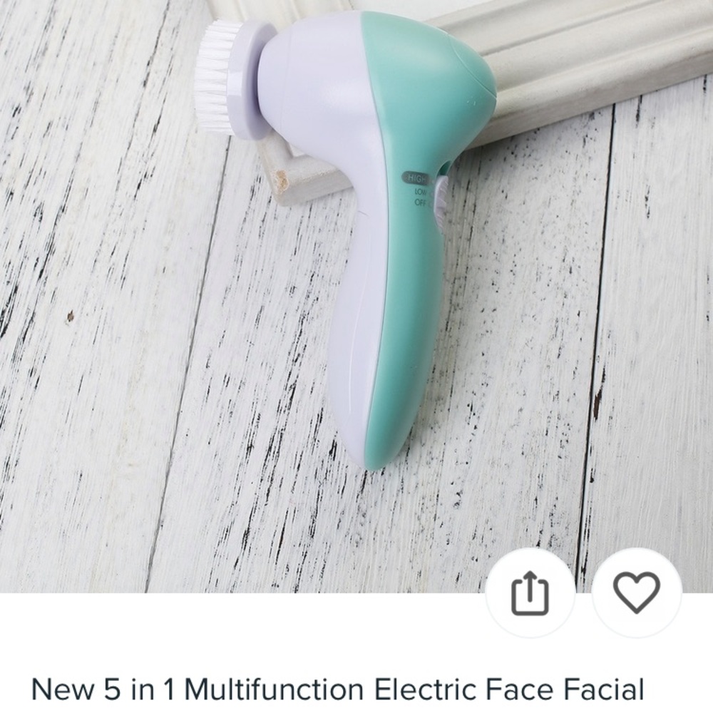Sea foam green electric facial cleansing brush
